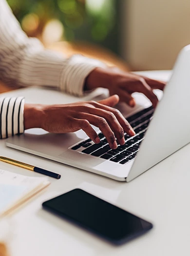 a person typing on a laptop