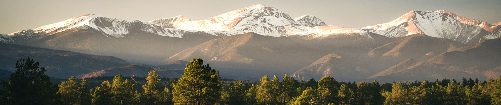 a mountain range with snow on top