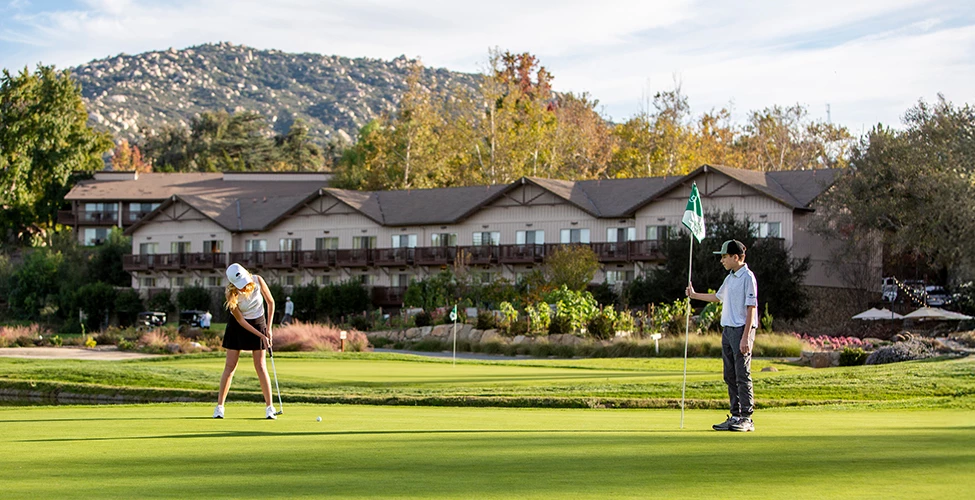 a group of people playing golf