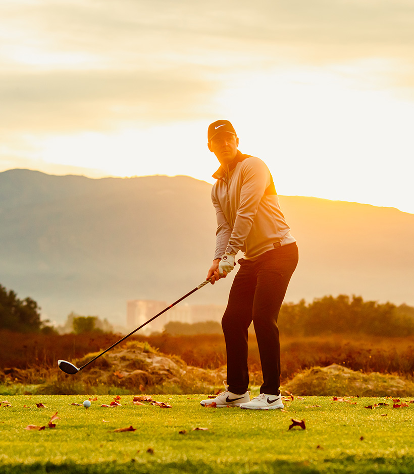 a man swinging a golf club