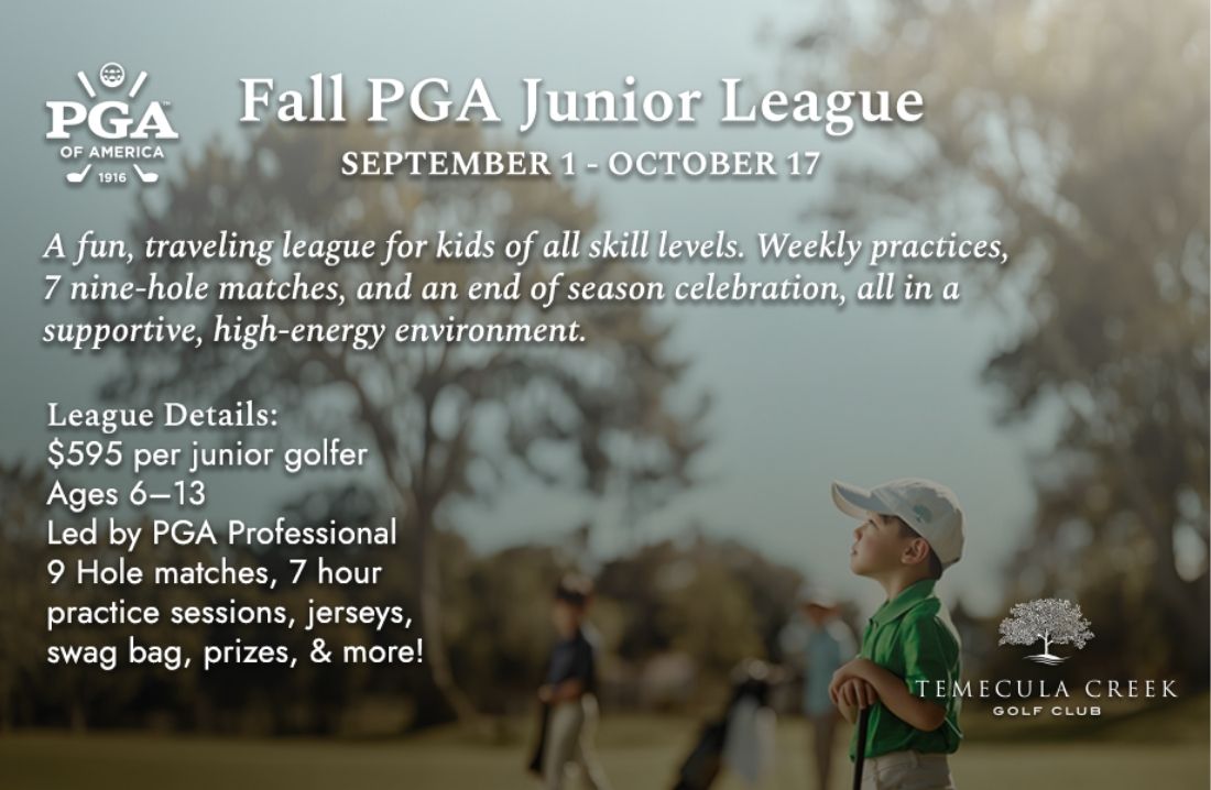 a young boy standing on a golf course