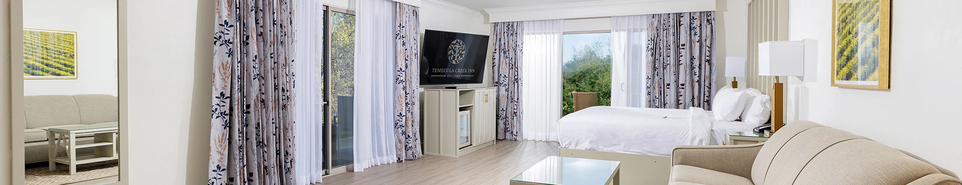 a room with a television and a bed