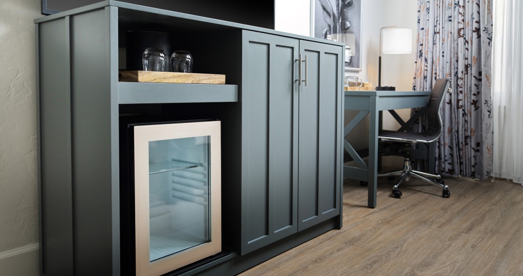 a room with a desk and a cabinet