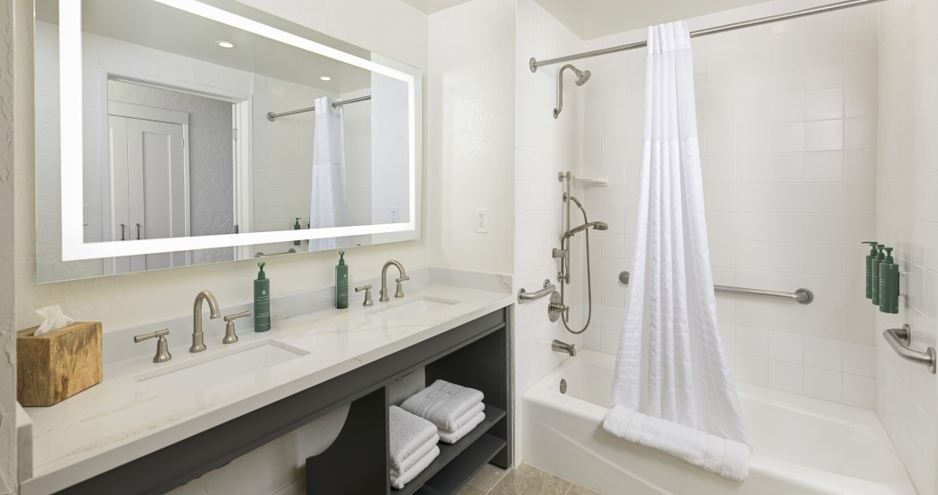 a bathroom with a white shower and a bathtub
