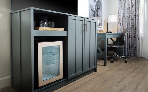 a room with a desk and a cabinet