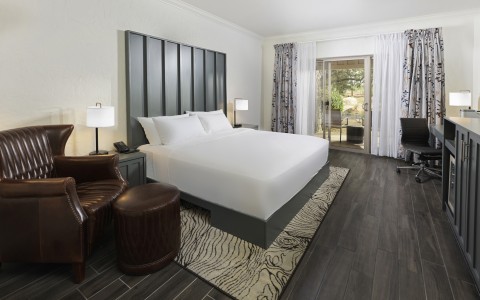 a room with a bed and a piano