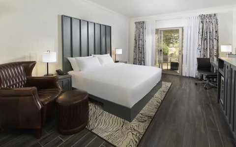a room with a bed and a piano