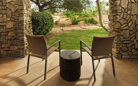 two chairs and a table outside