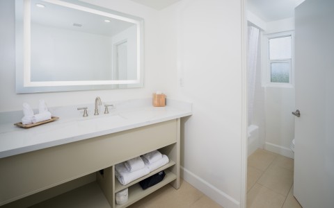 a bathroom with a mirror and sink
