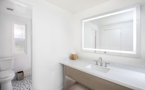 a bathroom with a mirror and sink