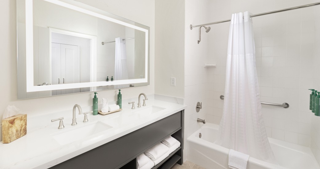 a bathroom with a bathtub and a shower curtain