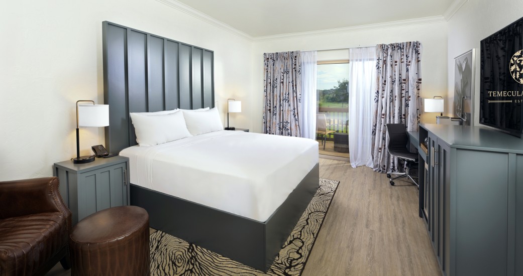 a room with a bed and a desk