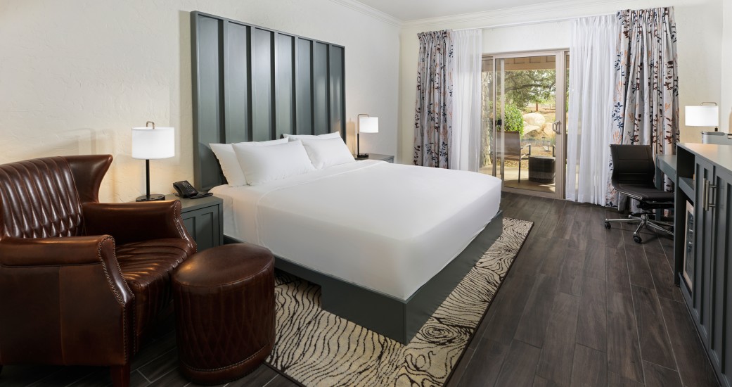 a room with a bed and a piano