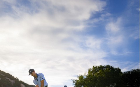 a man playing golf on a golf course