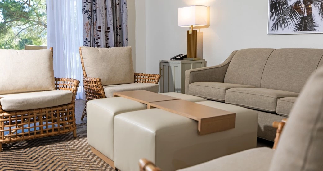 a living room with a couch and chairs