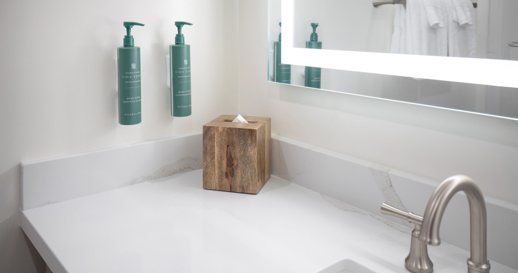 a bathroom with a mirror and a box of tissues
