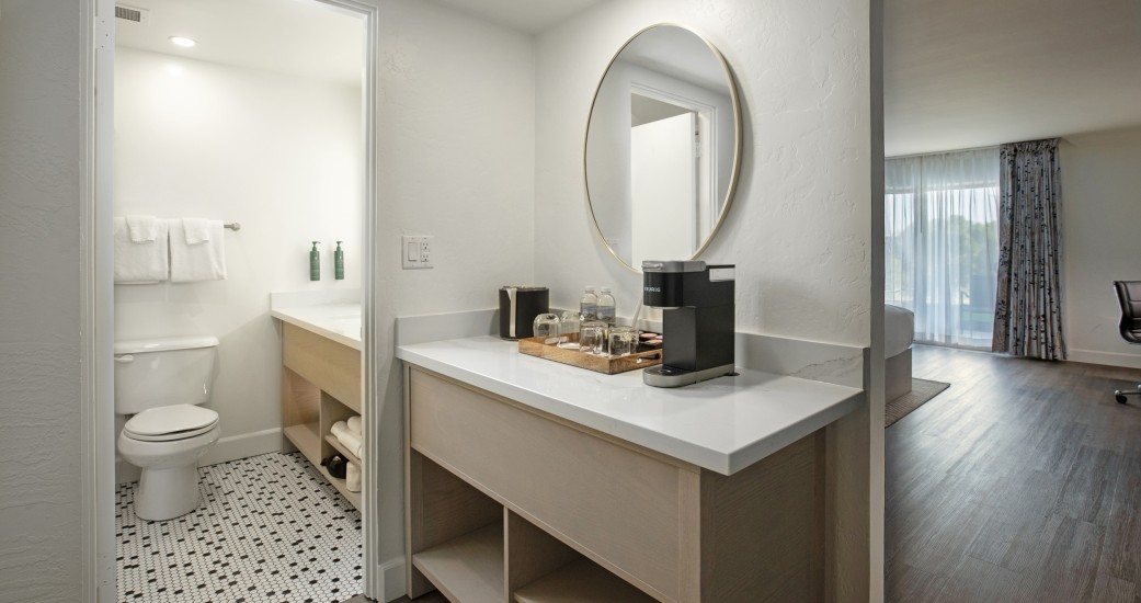 a bathroom with a mirror and a toilet