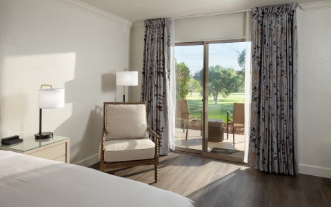 a room with a bed and a chair