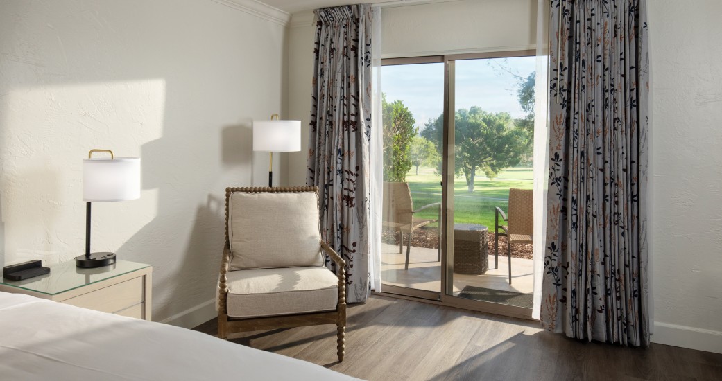 a room with a bed and a chair