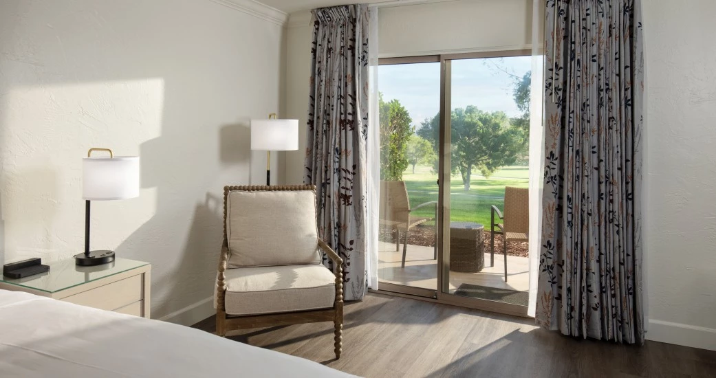 a room with a bed and a chair