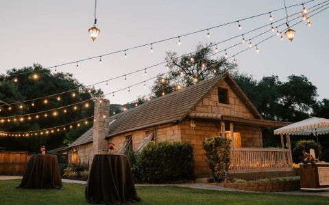 a house with a table and string of lights