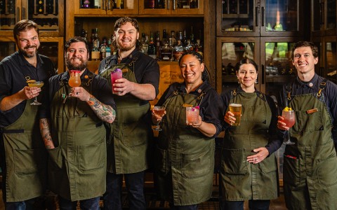 a group of people holding drinks