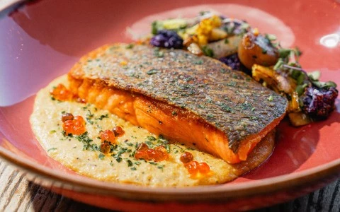 a plate of food on a red surface