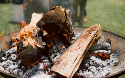 a fire pit with wood burning