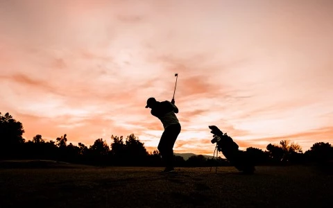 a man swinging a golf club