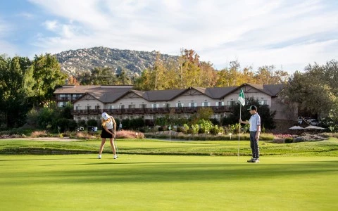 a man and woman playing golf