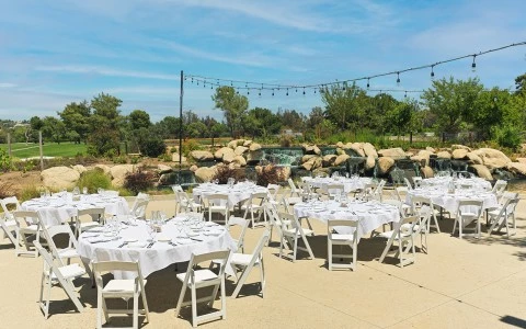 a group of tables set up for a wedding reception