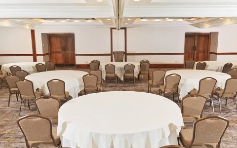 a room with round tables and chairs