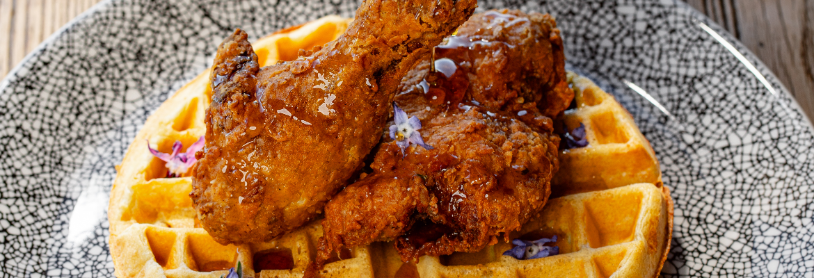 a chicken and waffles on a plate