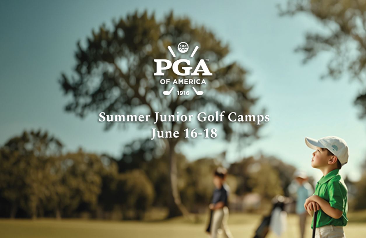 a group of kids walking on a golf course