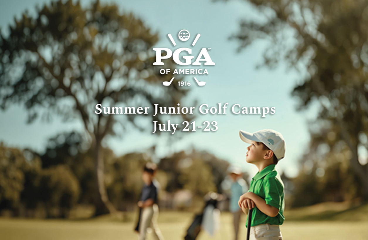 a boy holding a golf club
