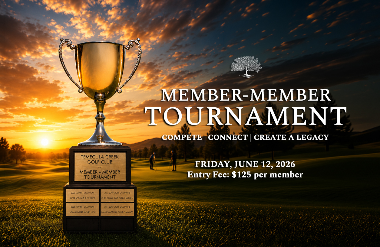 a trophy on a pedestal in a golf course