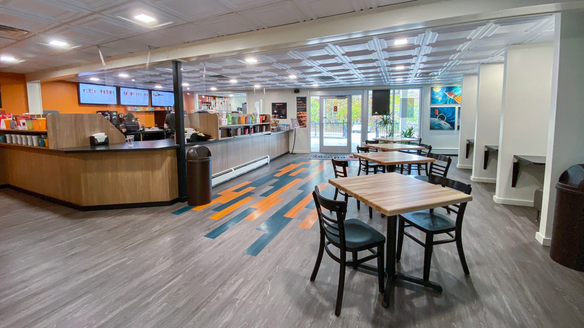 a restaurant with tables and chairs