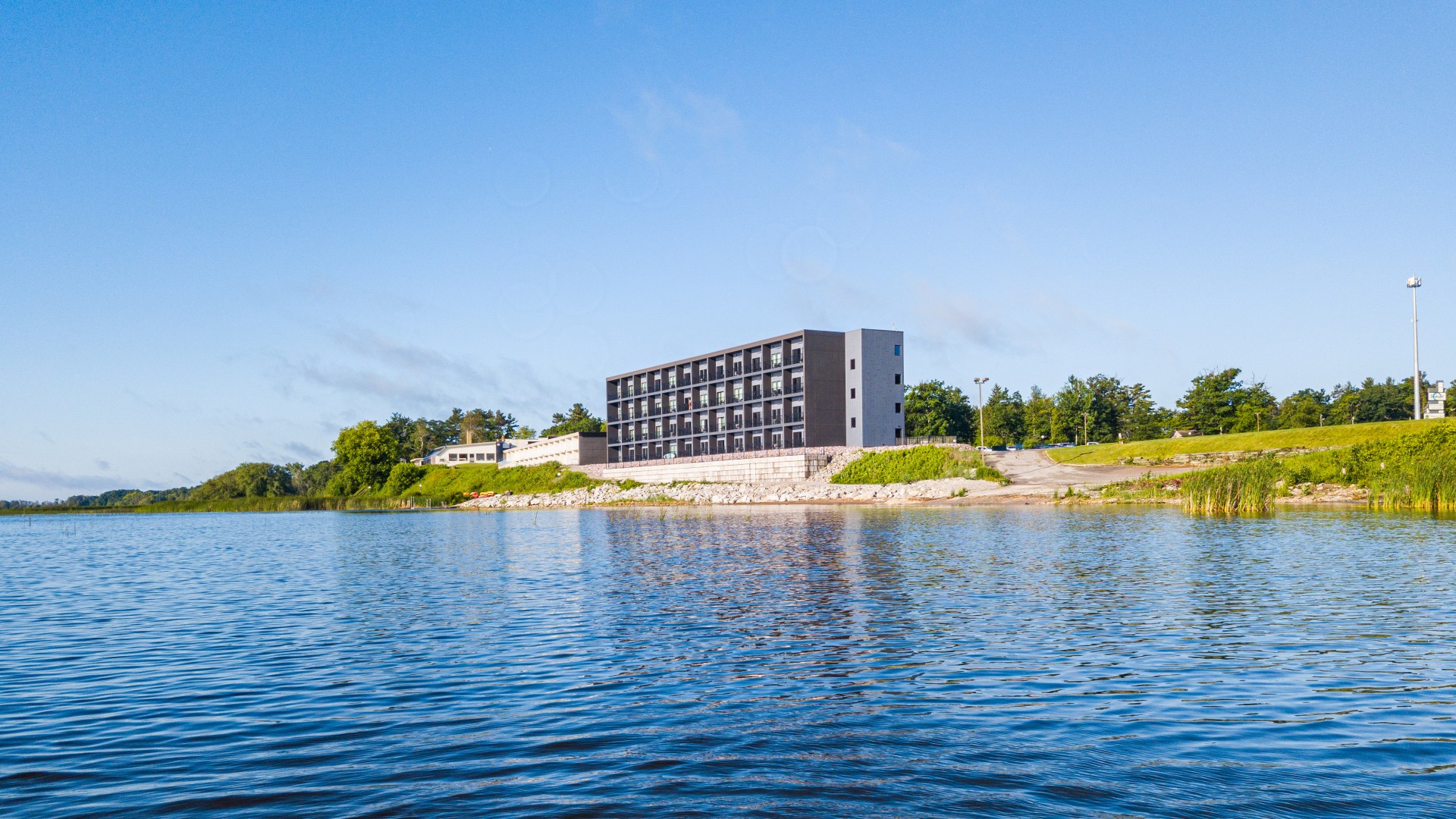 a building next to a body of water