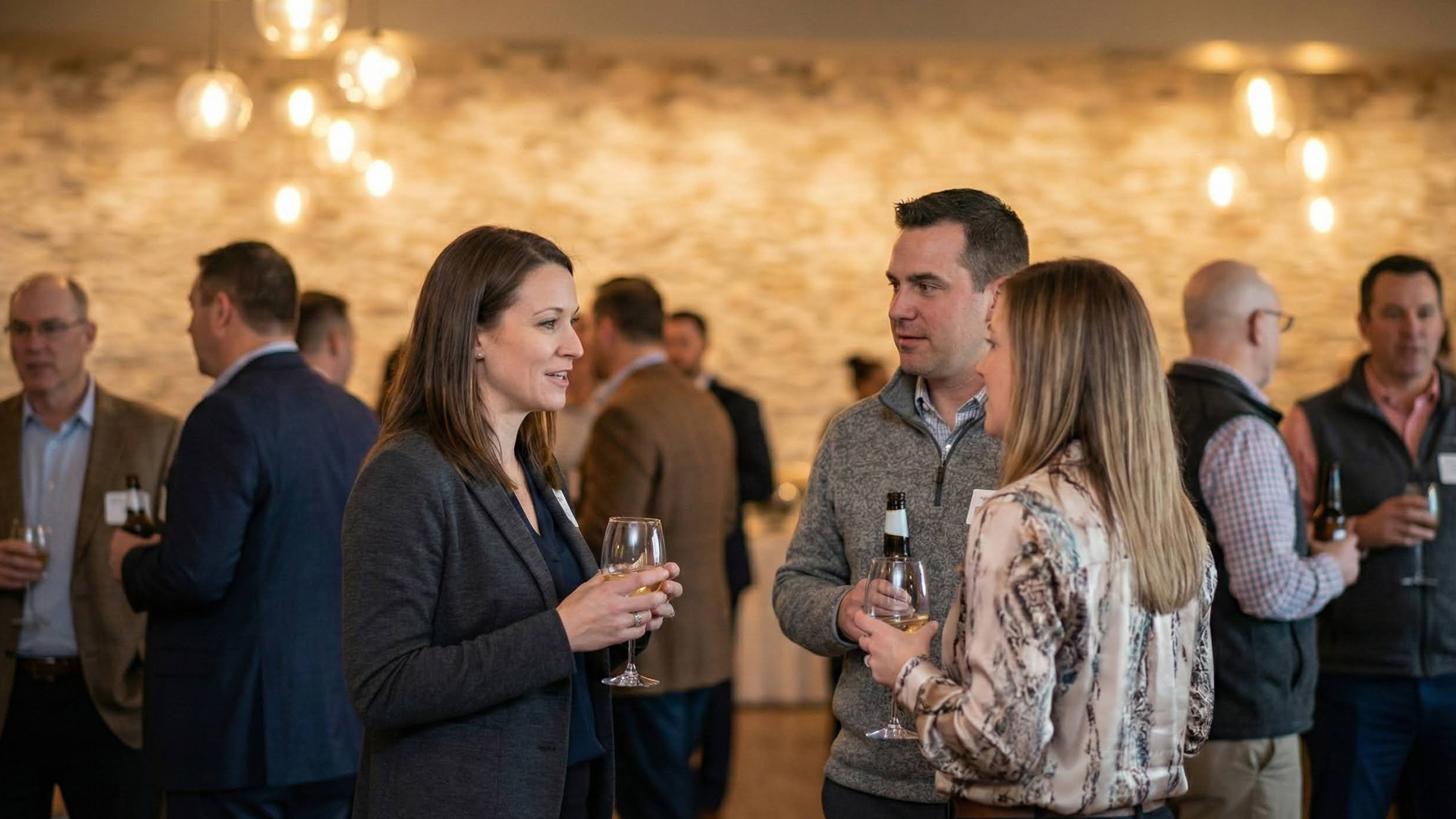 a group of people holding wine glasses