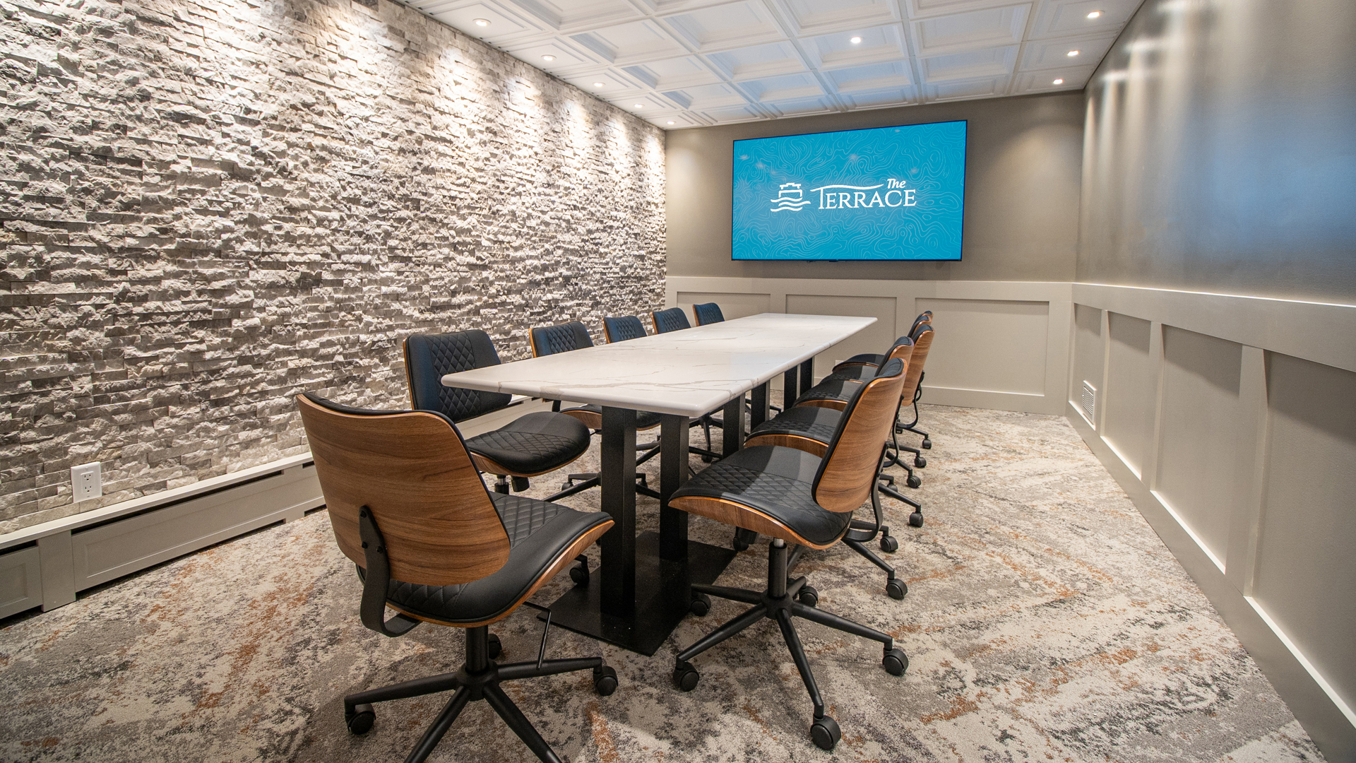 a conference room with a table and chairs