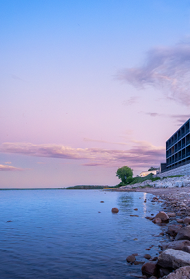 a building next to a body of water