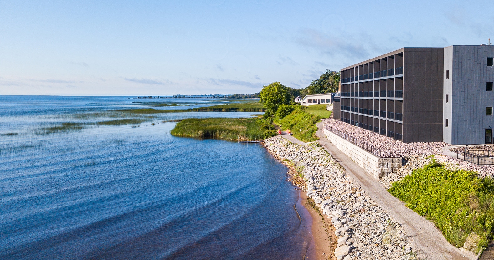 a building next to a body of water