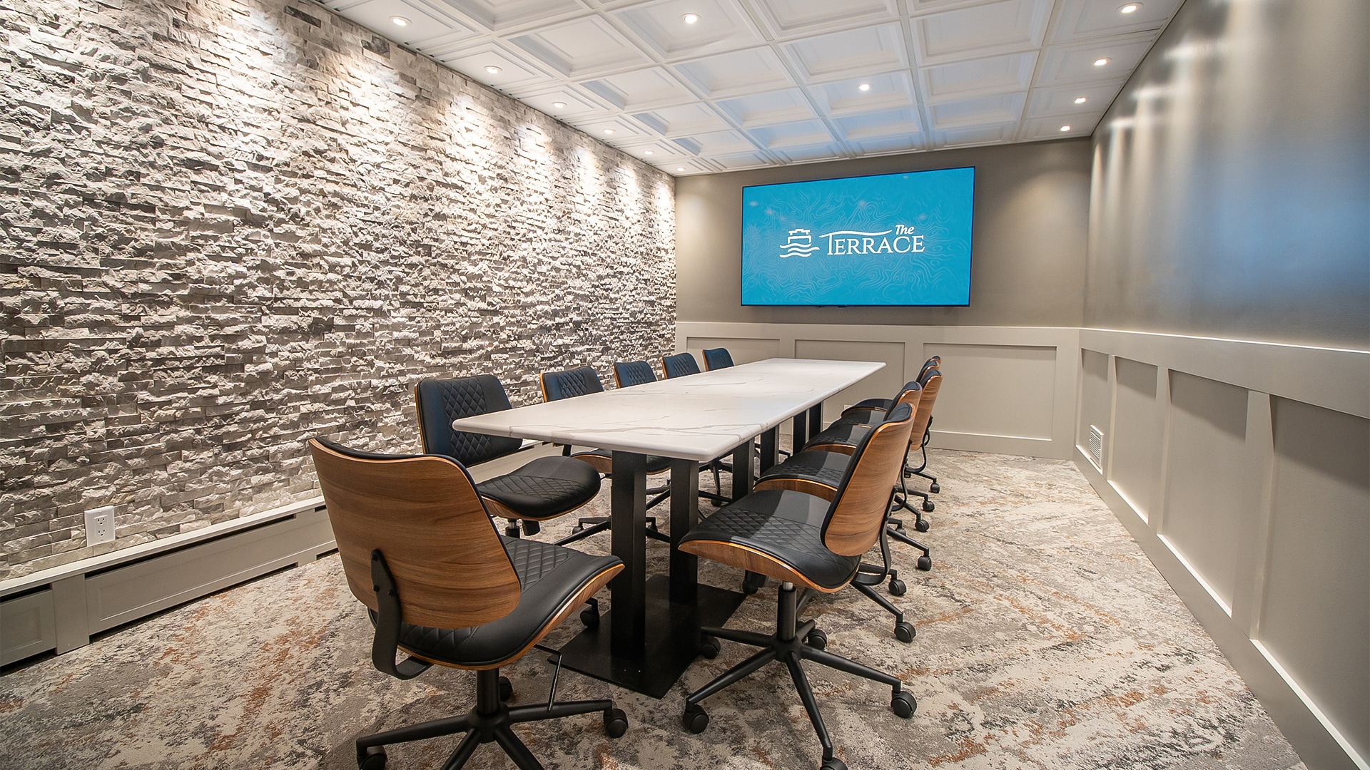 a conference room with a table and chairs