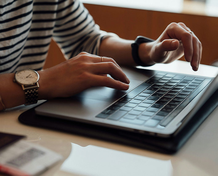 a person typing on a laptop