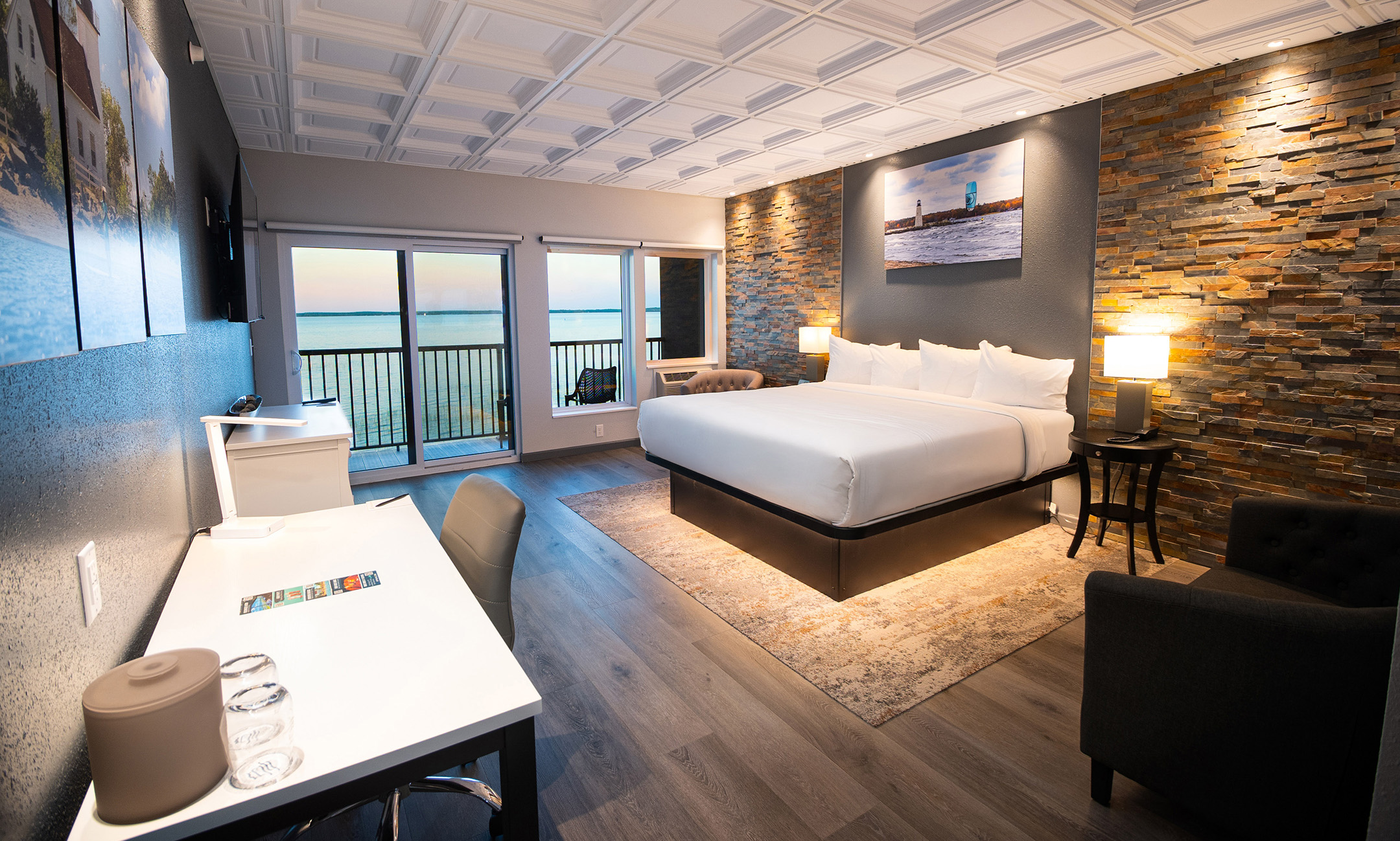 a room with a bed and a table and chairs