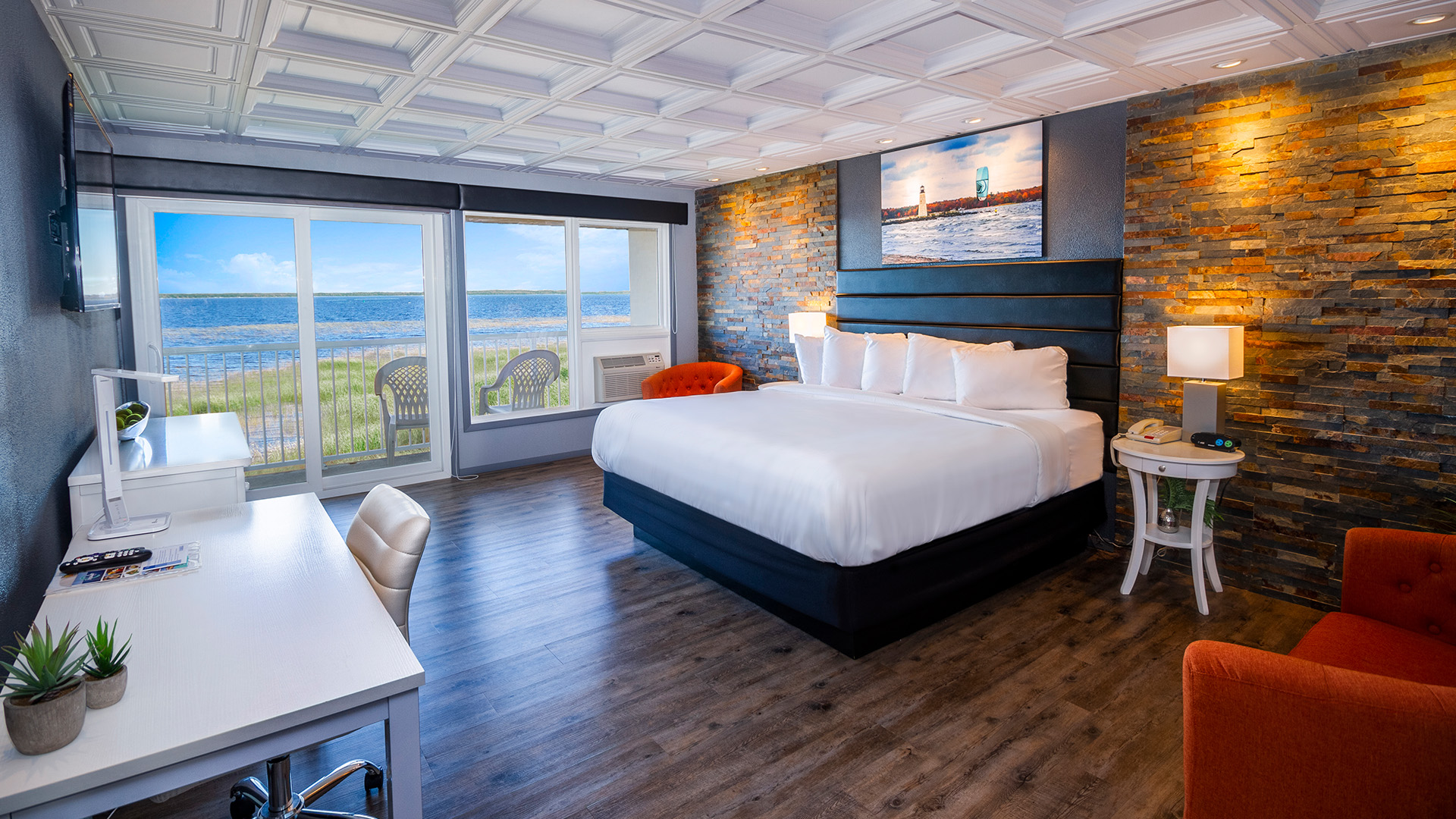 a room with a bed and a table and chairs