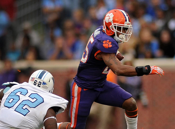 a clemson football team player running on the field
