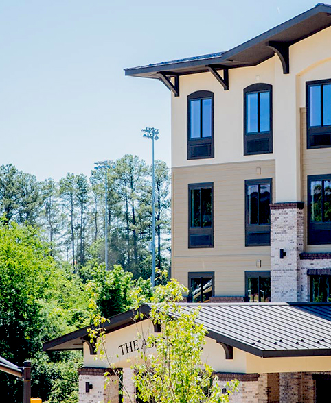 a building with trees in the background
