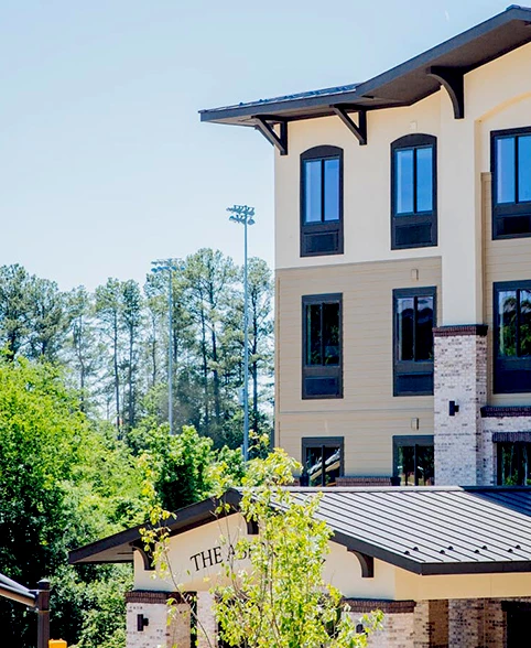 a building with trees in the background