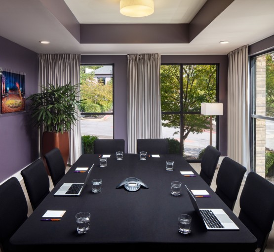 a conference room with a table and chairs gallery
